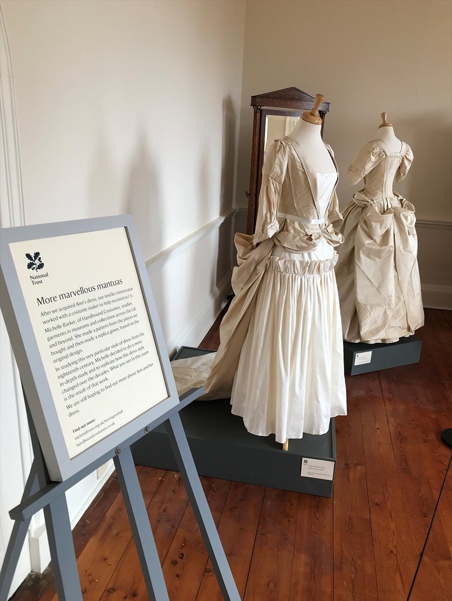 Two cream Mantua dresses in the ‘A Dress Fit for a King’ exhibition at Berrington Hall.   