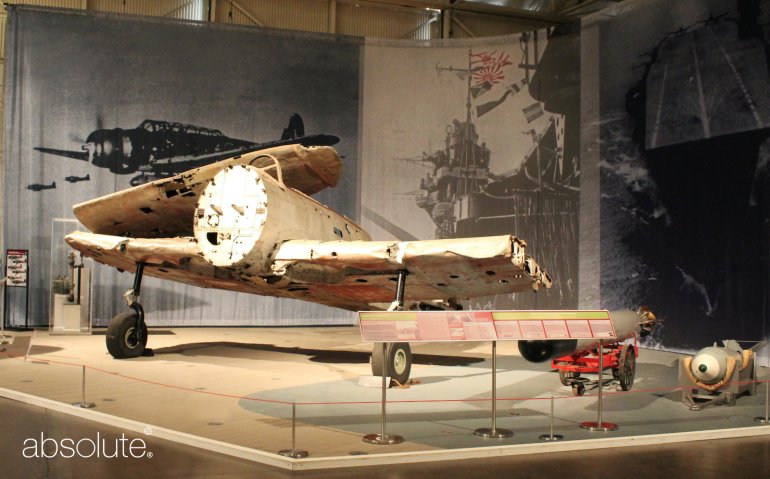 An exhibition at the Pearl Harbor Aviation Museum, protected by Freestanding Barriers and related information displayed on an Extender Reader Rail.